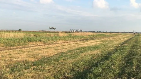 Crop duster flies low and sprays chemicals. Stock Footage 117486609