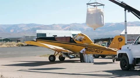 Crop duster seed drop aircraft loading airport HD 3428 Video stock 12235481