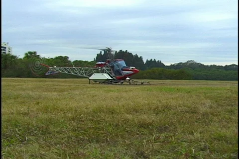Crop Dusting AG Helicopter Takes Off From a Field Stock Footage 160128
