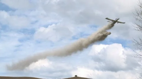 Crop dusting plane in action Stock Footage 12281457