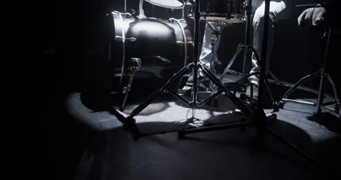 Crop faceless drummer pushing pedals during concert in club Stock Footage 249853625