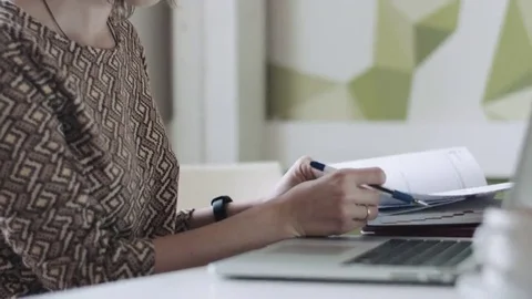 Crop female checking diary and typing Stock Footage 69268225