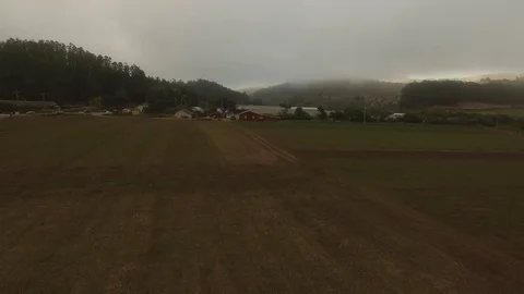 Crop Field Rows &amp; Farm under Fog - Aerial Drone Stock Footage 71192407