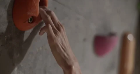 Crop hand of coach climbing wall at gym Stock Footage 259983442