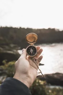 Crop hand with compass nature Stock Photos