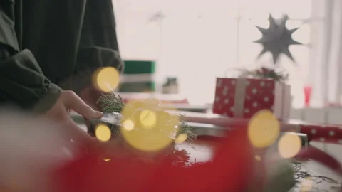 Crop hands decorating wrapped box with string. Female packing cardboard gift box Stock Footage 165641613