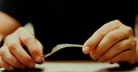 Crop hands holding fork in cafe Stock Footage 104180587