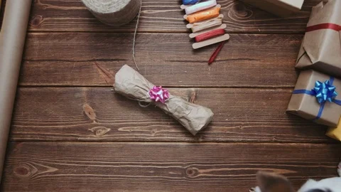 Crop hands unwrapping bone for pet Stock Footage 69930088