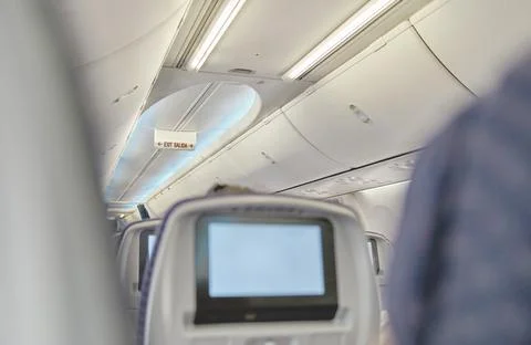 Crop image of airplane screen device for entertainment to serve passenger Stock Photos