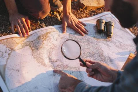 Crop man exploring map. High quality photo Stock Photos