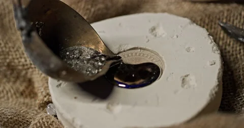 Crop man making silver coin Video stock 168928141