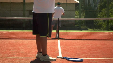 Crop man preparing for tennis match with opponent Stock Footage 138429971
