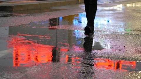 Crop of man stepping in puddle on street Stock Footage 87665375