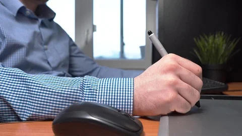 Crop man working with graphic tablet Stock Footage 103497431