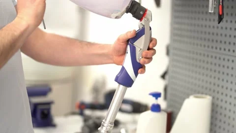 Crop master adjusting prosthetic leg at workshop Stock Footage 236621568