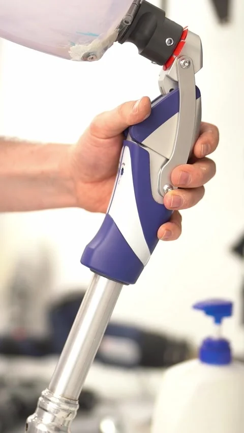 Crop master adjusting prosthetic leg at workshop. Vertical video Stock Footage 237606241