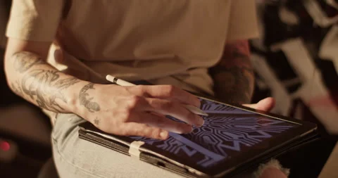 Crop master making new tattoo design on digital tablet Stock Footage 241090231