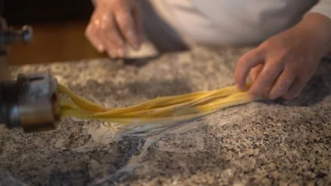 Crop master making pasta with special machine Stock Footage 240415003
