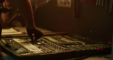 Crop mechanic taking maintenance tools from workbench Stock Footage 265009688