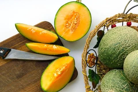 Crop of melons with a green bark and an orange midst. Stock Photos