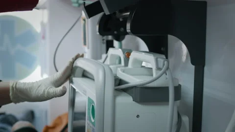 Crop paramedic using defibrillator in ambulance Stock Footage 167962105