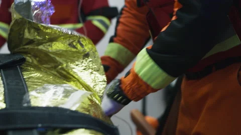 Crop paramedics doing intravenous drip procedure Video stock 166151027