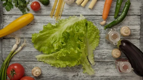 Crop people taking lettuce from table Video stock 119955100