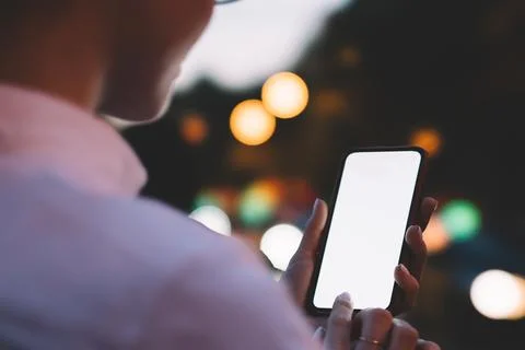 Crop person using application on smartphone Stock Photos