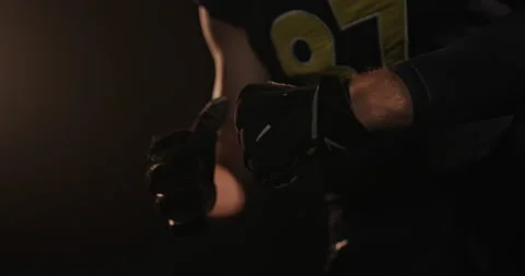 Crop rugby player cracking knuckles in dark studio Stock Footage 150123218
