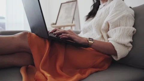 Crop self employed lady using laptop on sofa Stock Footage 265281891