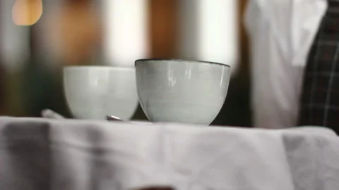 Crop server carrying tray wit coffee Video stock 85502352