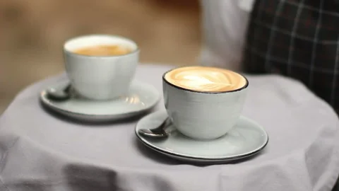 Crop server carrying tray wit coffee Stock Footage 85502443