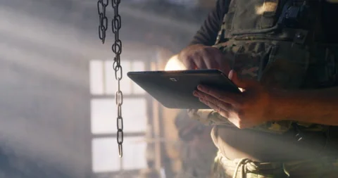 Crop soldier browsing data on tablet Stock Footage 141088898