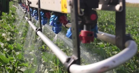 Crop sprayer working on a soybean field, slow motion Stock Footage 246699784