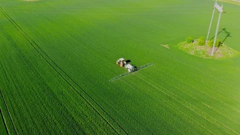 Crop sprayer working on a wheat field Stock Footage 108727624