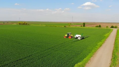 Crop sprayer working on a wheat field Stock Footage 109478661