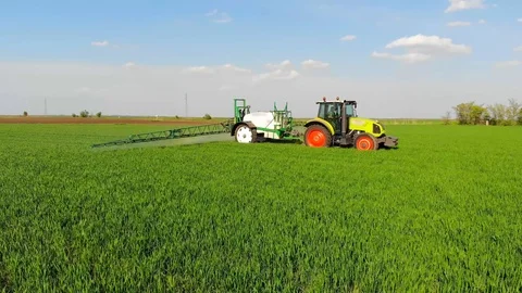 Crop sprayer working on a wheat field Stock Footage 109478779