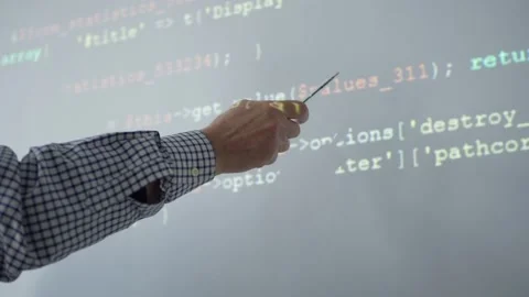 Crop teacher explaining code during lesson Stock Footage 142494349