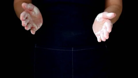 Crop unrecognizable person clapping hands with flour while cooking. Stock Footage 90075958