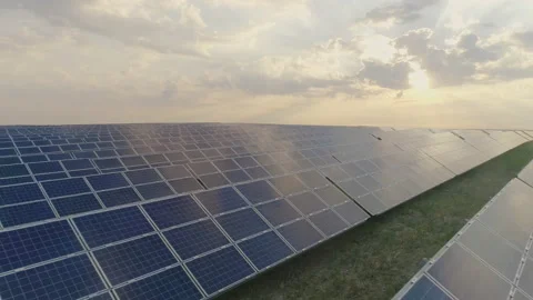 Crop view of alternative solar power farm panels standing in rows in field with Video stock 143144376