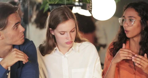 Crop view of cheerful multi ethnic friends communicating and smiling while 動画素材 135796440