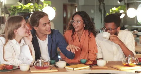 Crop view of funny guy gesturing and telling story while spending good time with Stock Footage 136528394