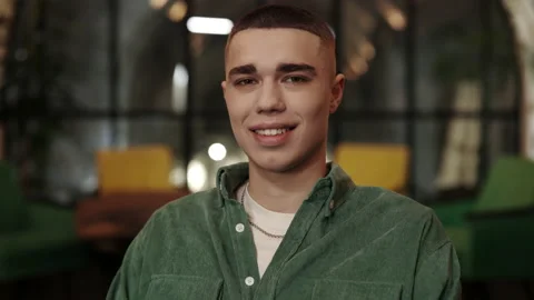 Crop view of millennial man with stylish haircut looking to camera. Portrait of Stock Footage 152161479