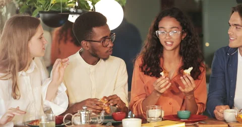 Crop view of multiethnic people smiling and chatting while spending time Stock Footage 135796472