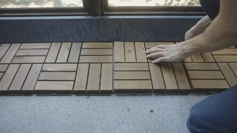 Crop View Of A Person Installing Interlo... | Stock Video | Pond5