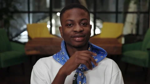 Crop view of young cheerful afro american guy propping and turning head while Stock Footage 152162912