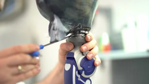 Crop worker assembling prosthetic leg at workshop Stock Footage 236623988