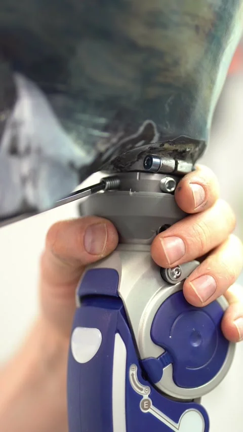 Crop worker assembling prosthetic leg at workshop. Vertical video Stock Footage 237608095