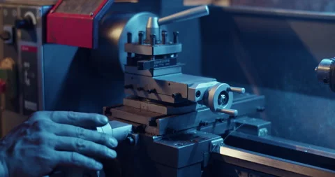 Crop worker using lathe machine in garage Stock Footage 259396106