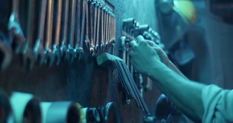 Crop workman taking wire from wall with tools Video stock 259390259